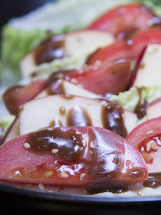 Simple salad with just a drizzle of balsamic vinaigrette.